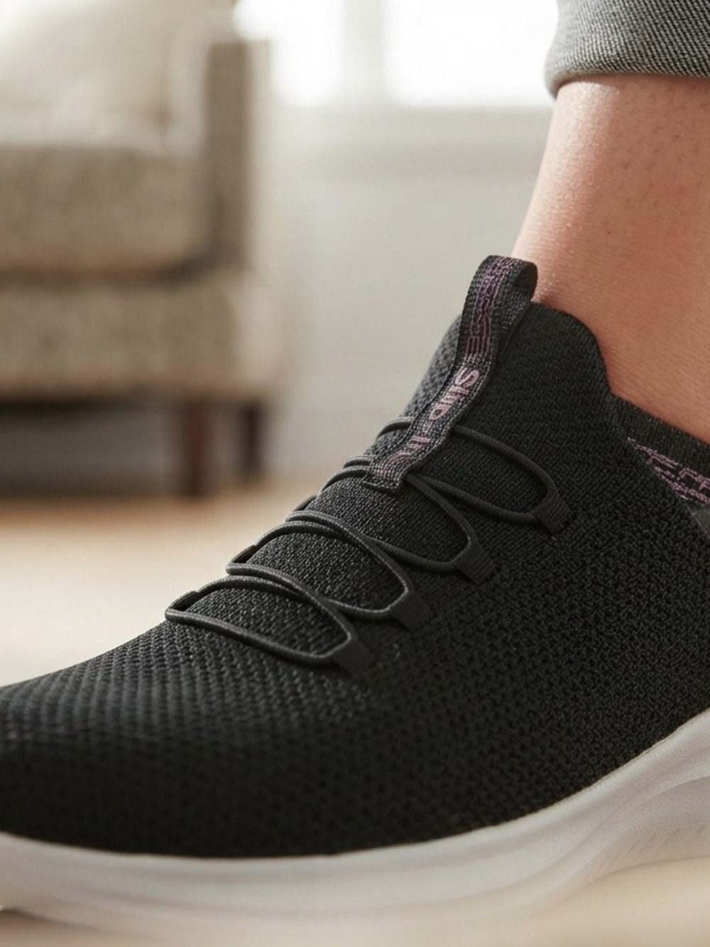 Skechers Women's Black Knit Slip-On Athletic Shoe with Subtle Purple Accent